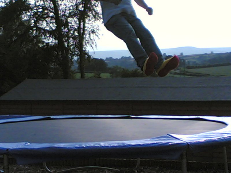 Pair of feet off the trampoline